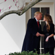 U.S. President Donald Trump shakes hands with former White House Communications Director Hope Hicks outside of the Oval Office as he departs the White House for a trip to Cleveland, Ohio on March 29, 2018.